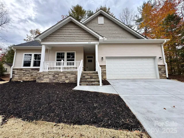 a front view of a house with a garage