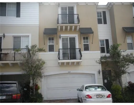 a front view of a house with parking