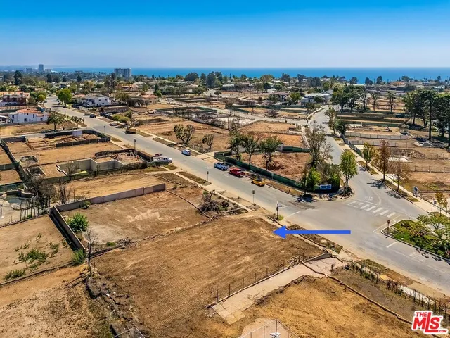 an aerial view of a parking space and city view