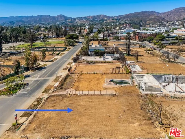 a view of a road with a building in the background