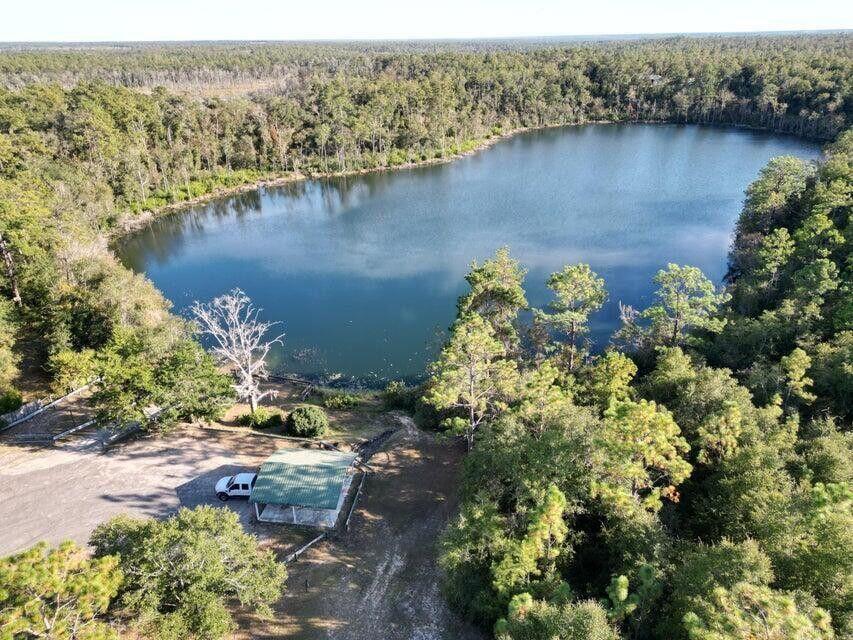 Lot 12 Windbrook Street Chipley, FL 32428 - Photo 2 of 11 an aerial view of a houses with a lake view