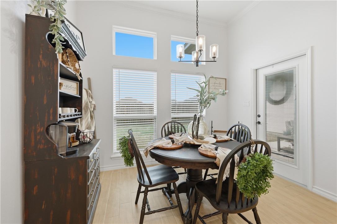 105 Sapphire Street Portland, TX 78374 - Photo 16 of 29 a dining room with furniture and window