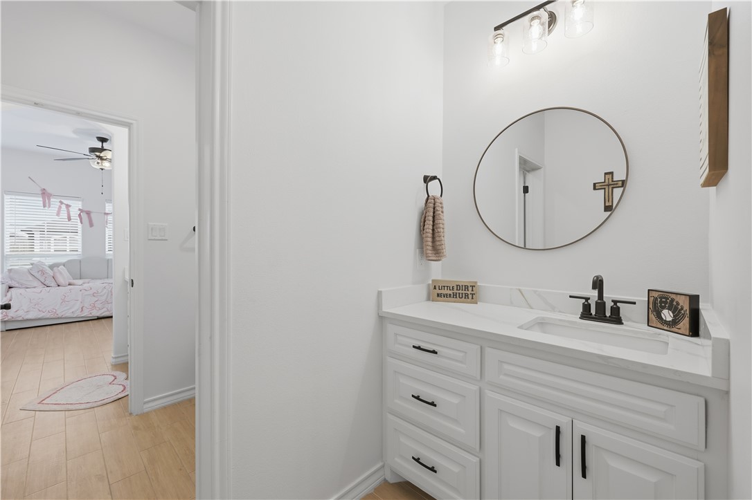 105 Sapphire Street Portland, TX 78374 - Photo 26 of 29 a bathroom with a sink and a mirror