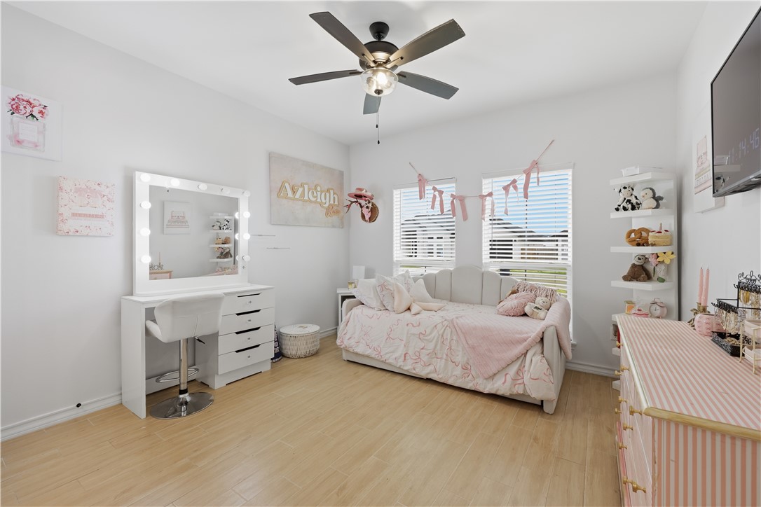 105 Sapphire Street Portland, TX 78374 - Photo 27 of 29 a bedroom with a bed workspace and window