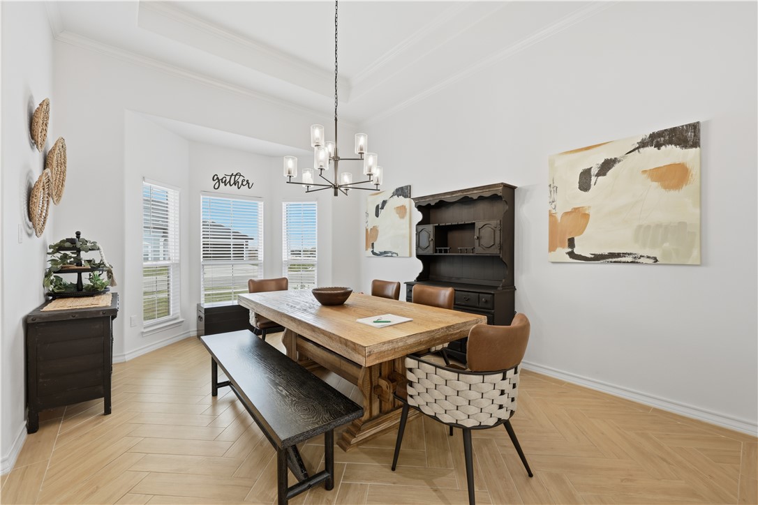 105 Sapphire Street Portland, TX 78374 - Photo 4 of 29 a view of a dining room with furniture window and wooden floor