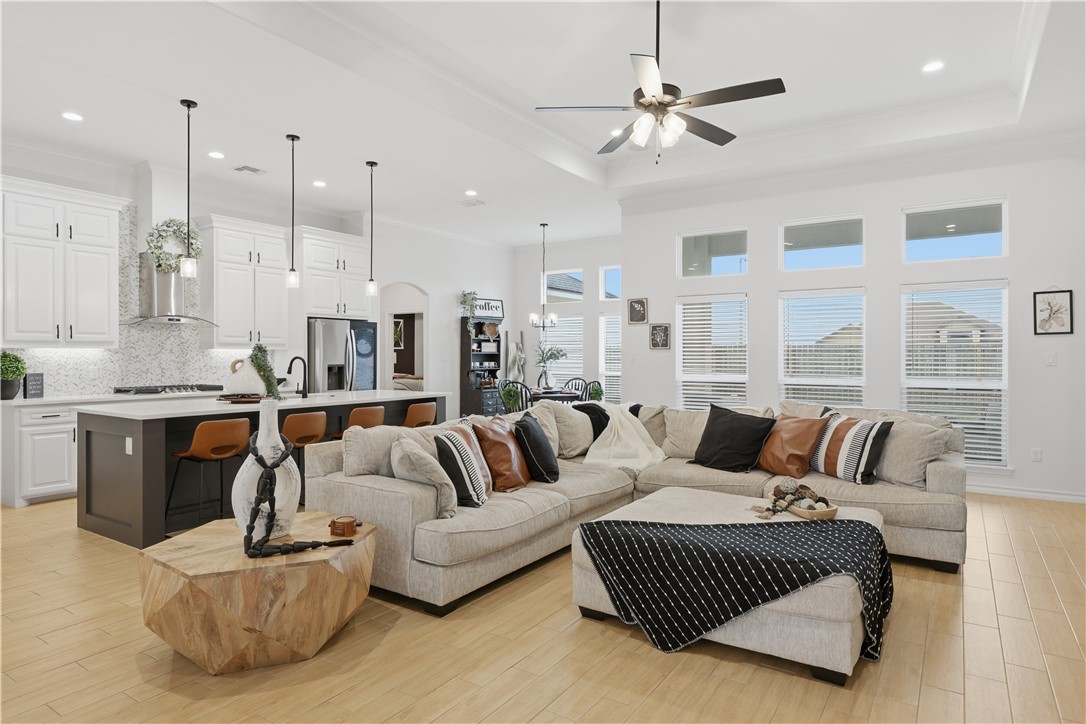 105 Sapphire Street Portland, TX 78374 - Photo 6 of 29 a living room with furniture kitchen and a chandelier