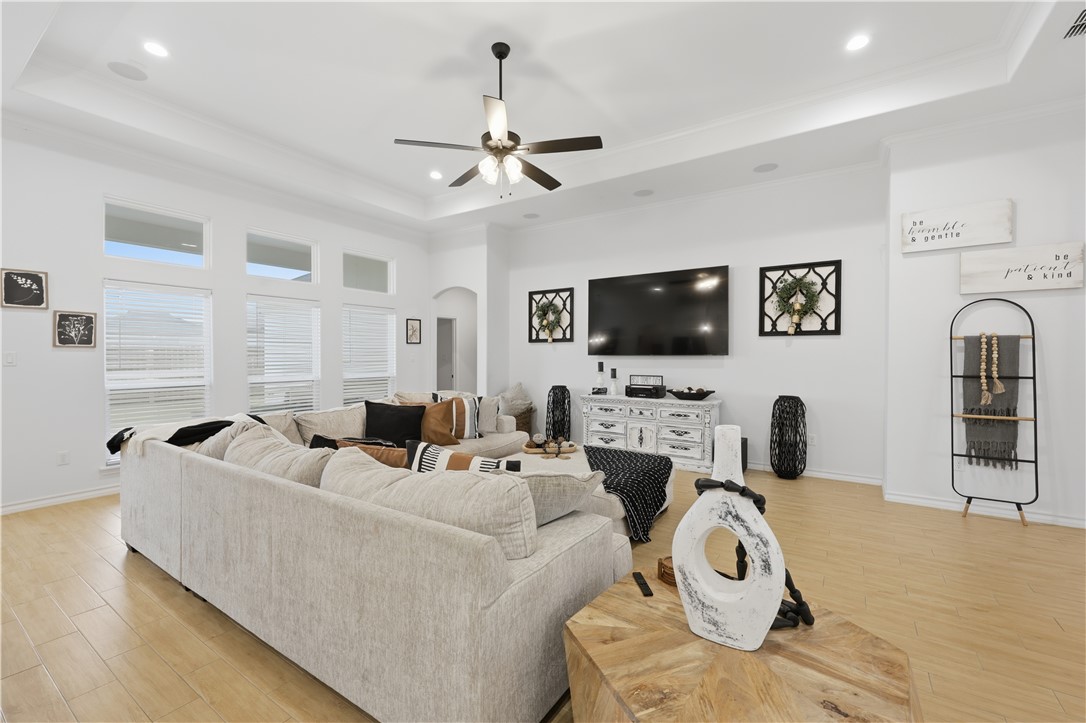 105 Sapphire Street Portland, TX 78374 - Photo 7 of 29 a living room with furniture a flat screen tv and a fireplace