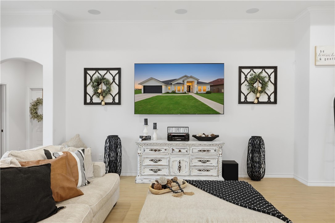 105 Sapphire Street Portland, TX 78374 - Photo 8 of 29 a bedroom with a bed and a flat screen tv