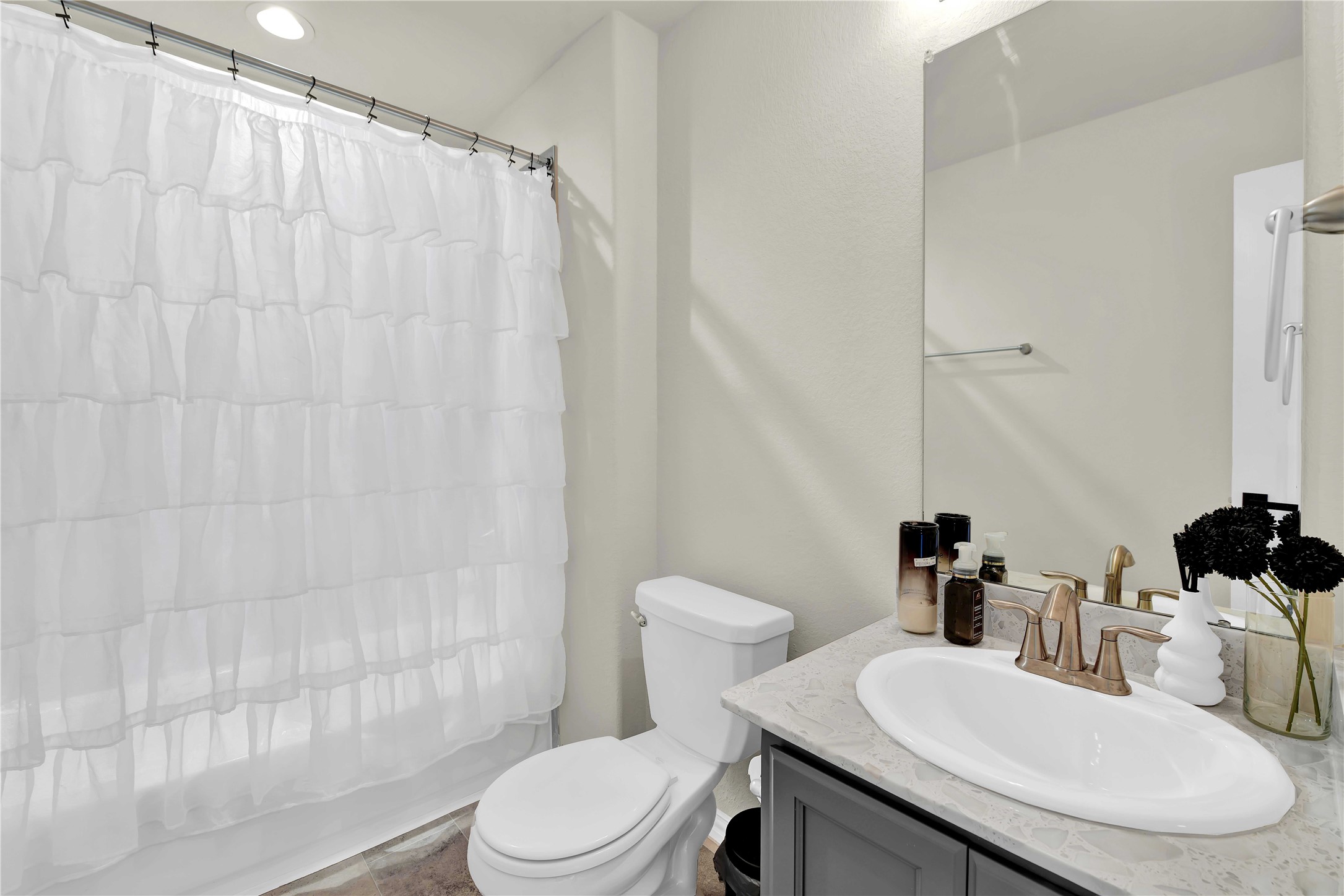 17703 Lion Heart Road Conroe, TX 77306 - Photo 20 of 26 a bathroom with a sink toilet and shower