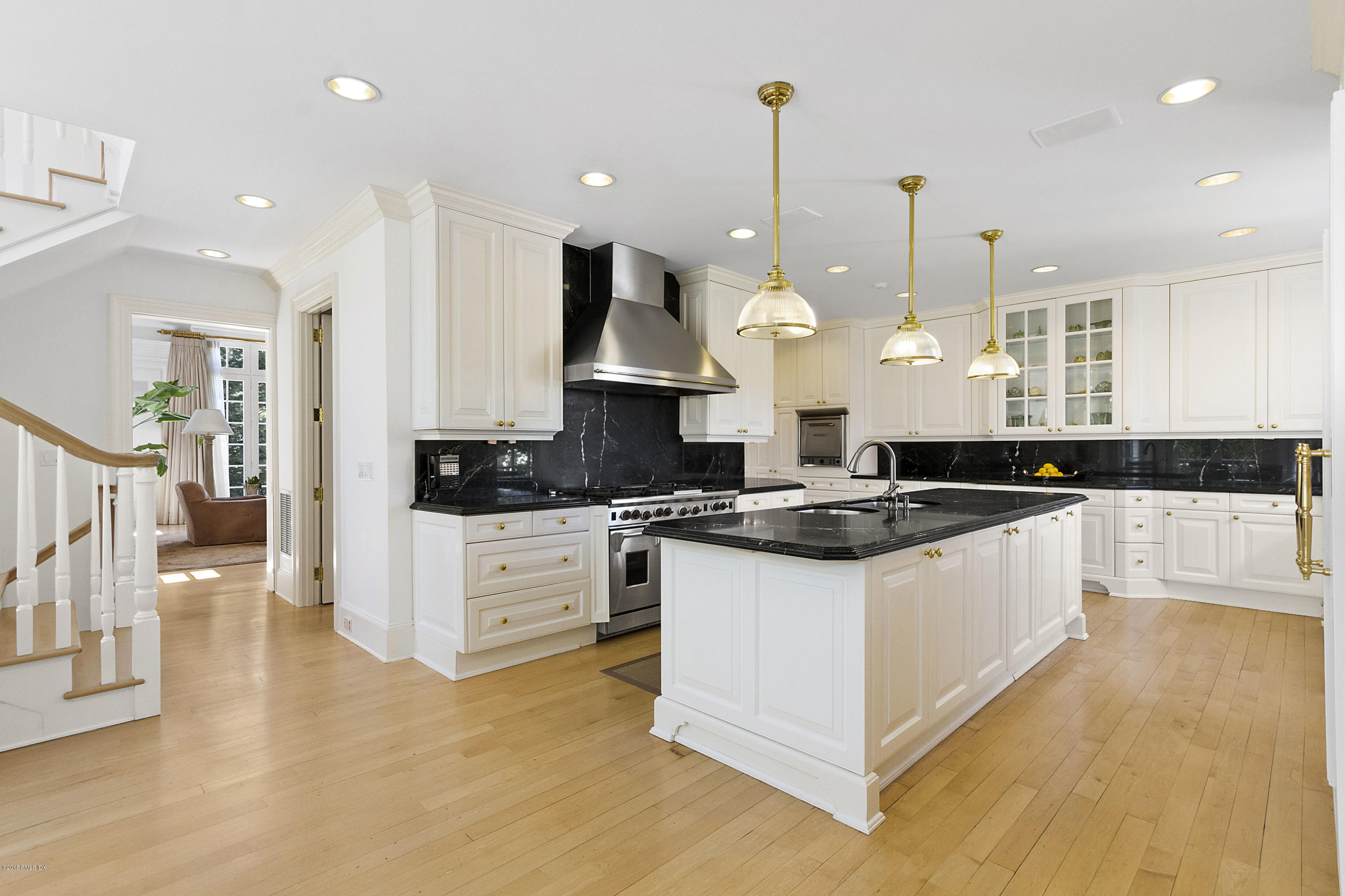 20 Andrews Farm Road Greenwich, CT 06831 - Photo 12 of 39 a large kitchen with stainless steel appliances a stove a sink a oven a center island and a wooden floor