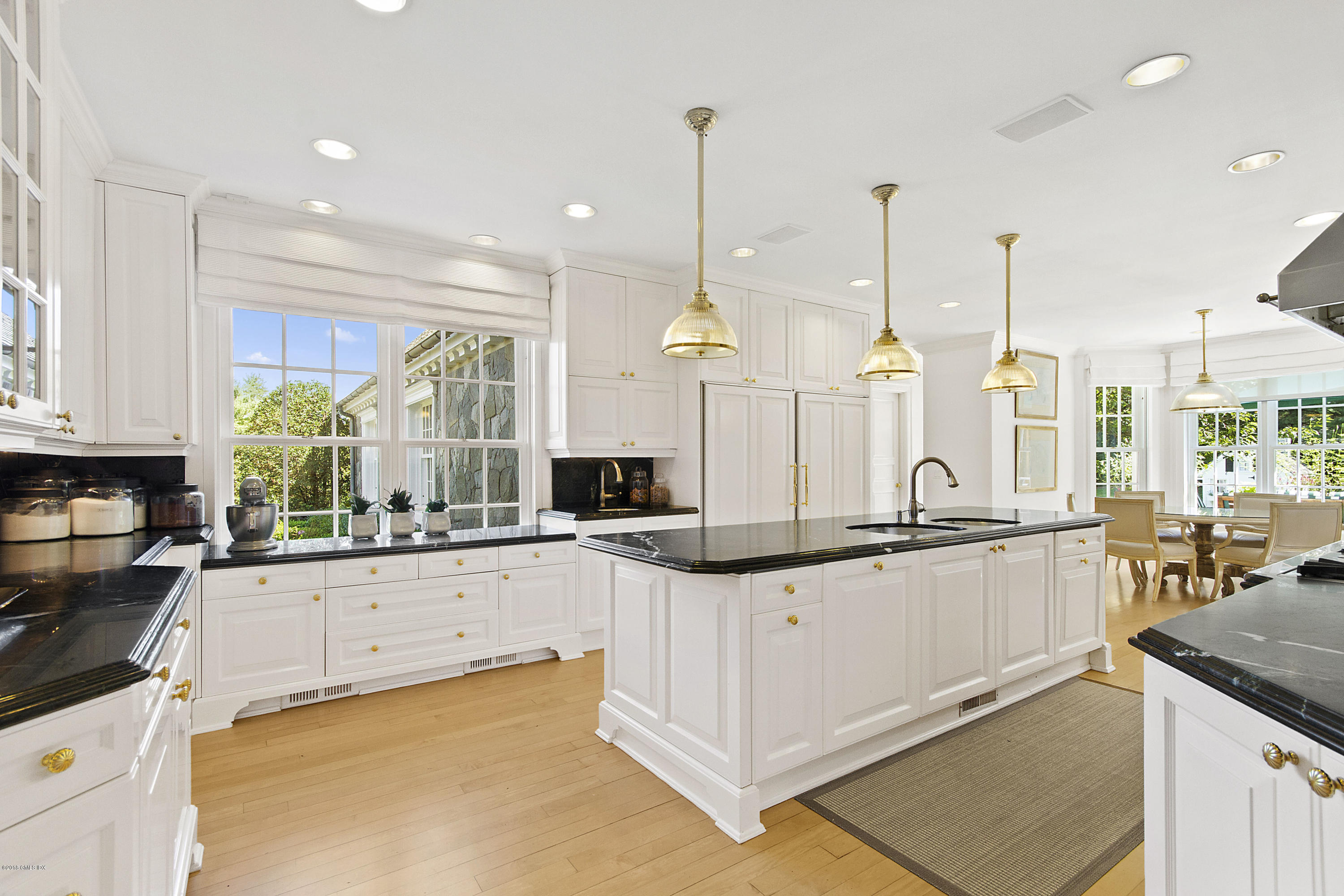 20 Andrews Farm Road Greenwich, CT 06831 - Photo 13 of 39 a kitchen with granite countertop a sink a counter top space appliances and cabinets