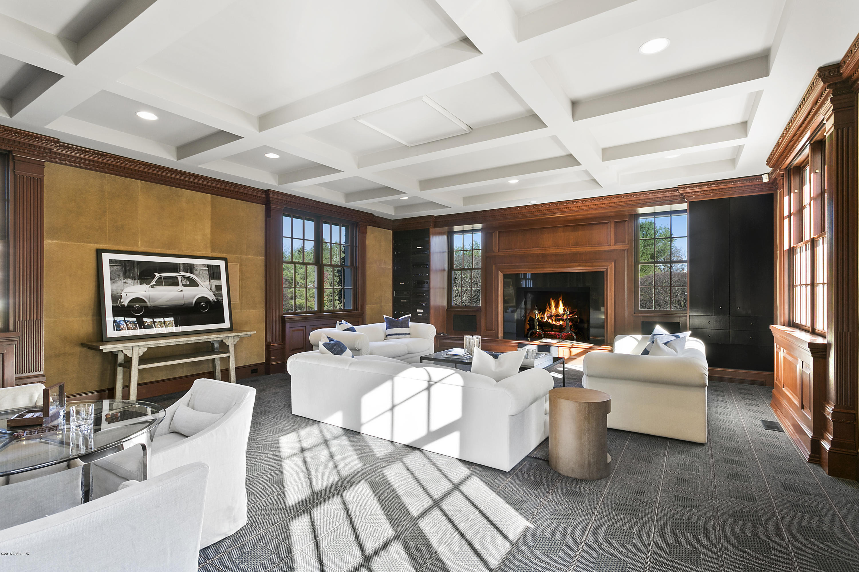 20 Andrews Farm Road Greenwich, CT 06831 - Photo 15 of 39 a living room with furniture two large window and a flat screen tv
