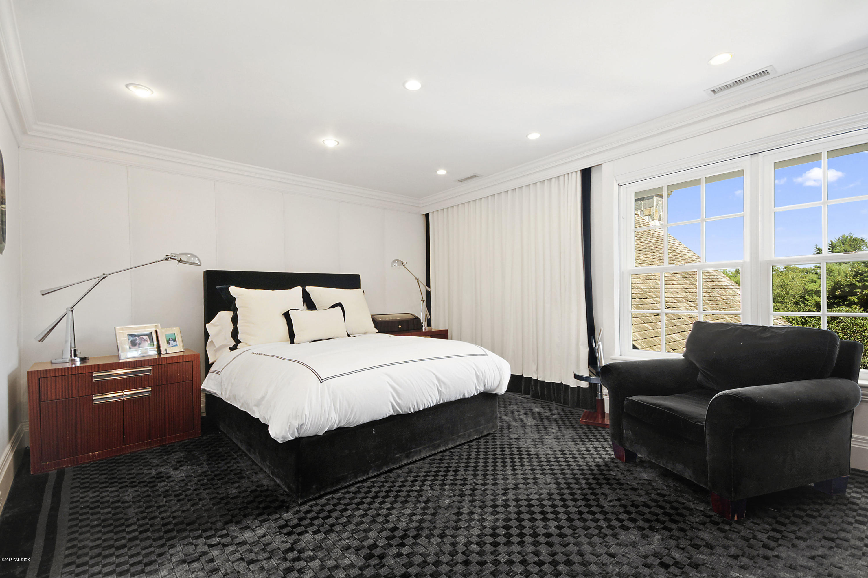 20 Andrews Farm Road Greenwich, CT 06831 - Photo 27 of 39 a bedroom with a bed and glass window