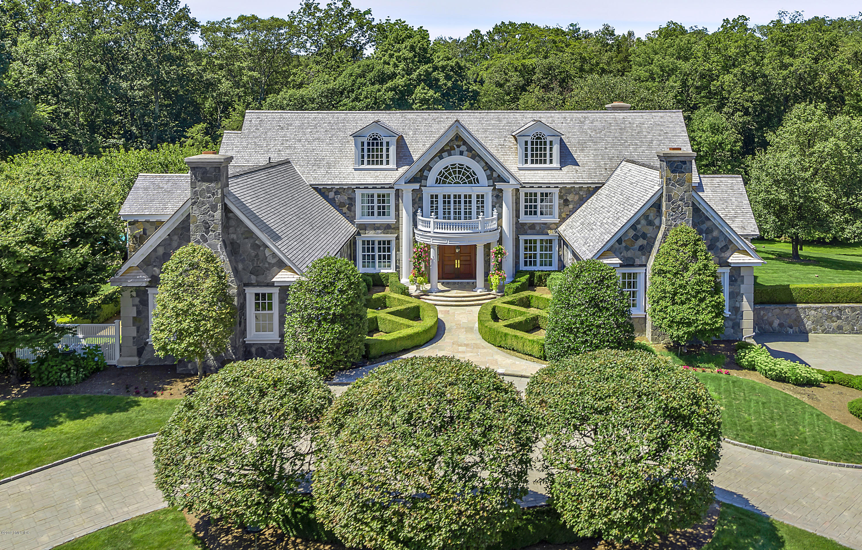 20 Andrews Farm Road Greenwich, CT 06831 - Photo 3 of 39 a aerial view of a house with a big yard plants and large trees