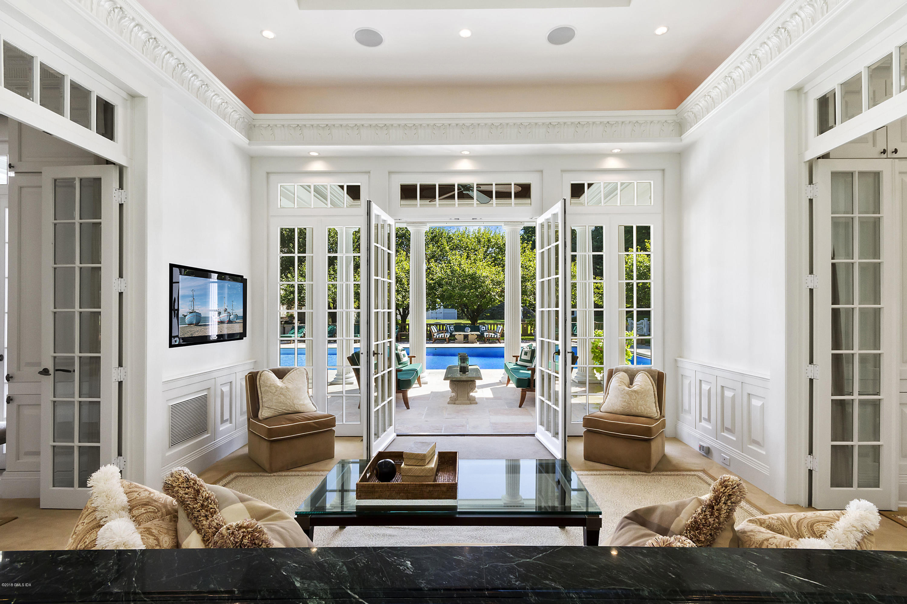 20 Andrews Farm Road Greenwich, CT 06831 - Photo 36 of 39 a living room with furniture large window and flat screen tv