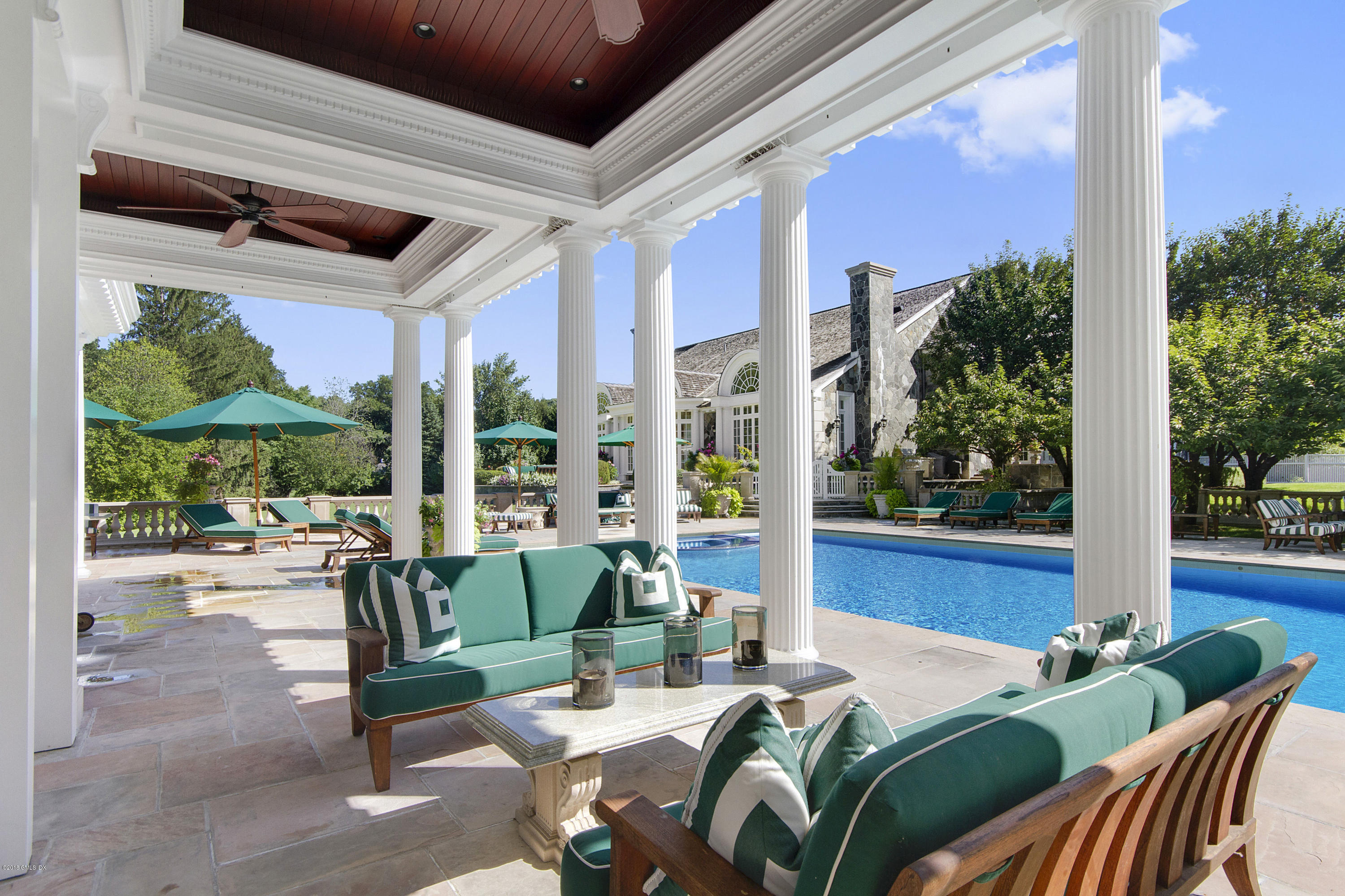 20 Andrews Farm Road Greenwich, CT 06831 - Photo 38 of 39 a view of a patio with couches chairs dining table and chairs