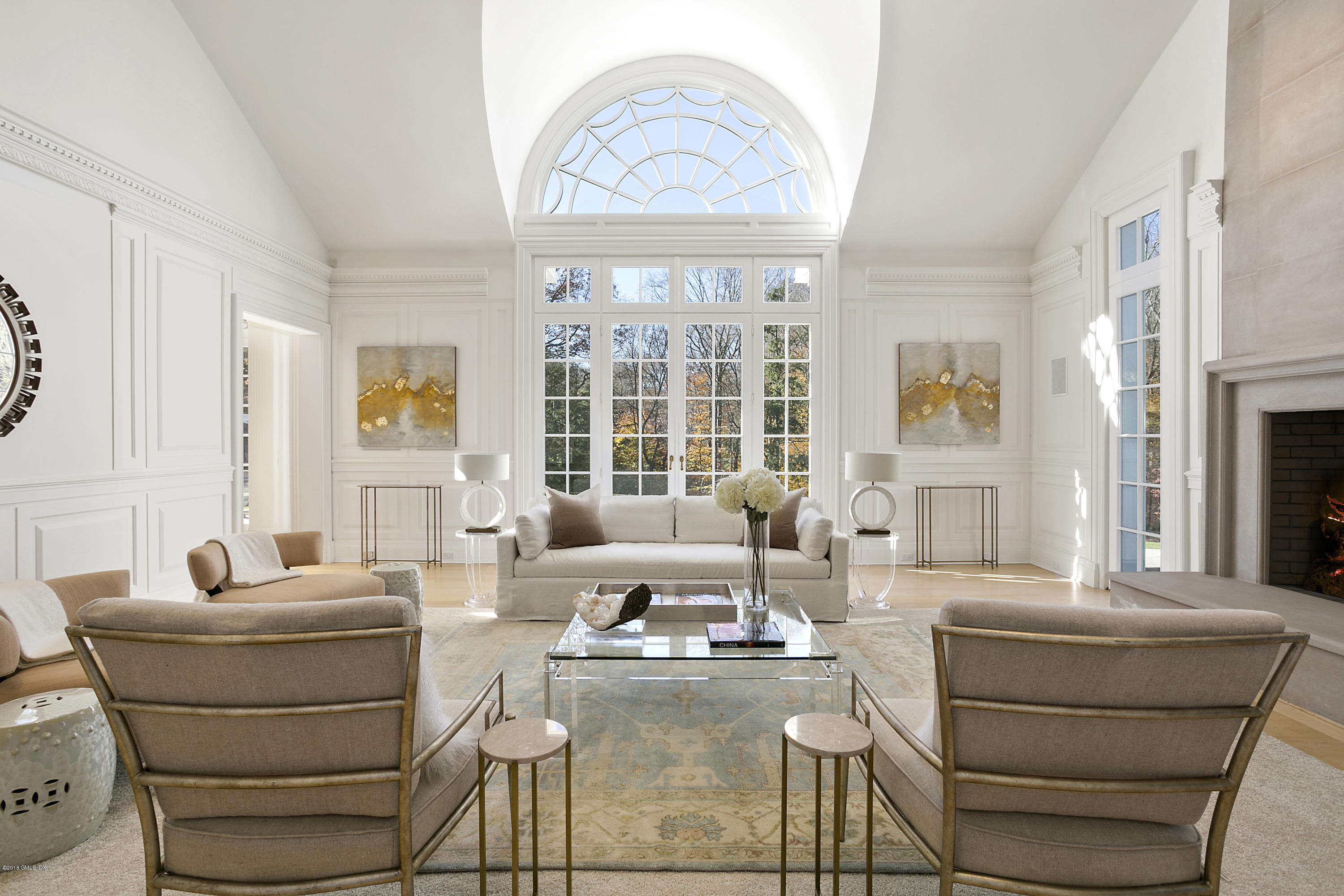 20 Andrews Farm Road Greenwich, CT 06831 - Photo 5 of 39 a living room with furniture a fireplace and a large window