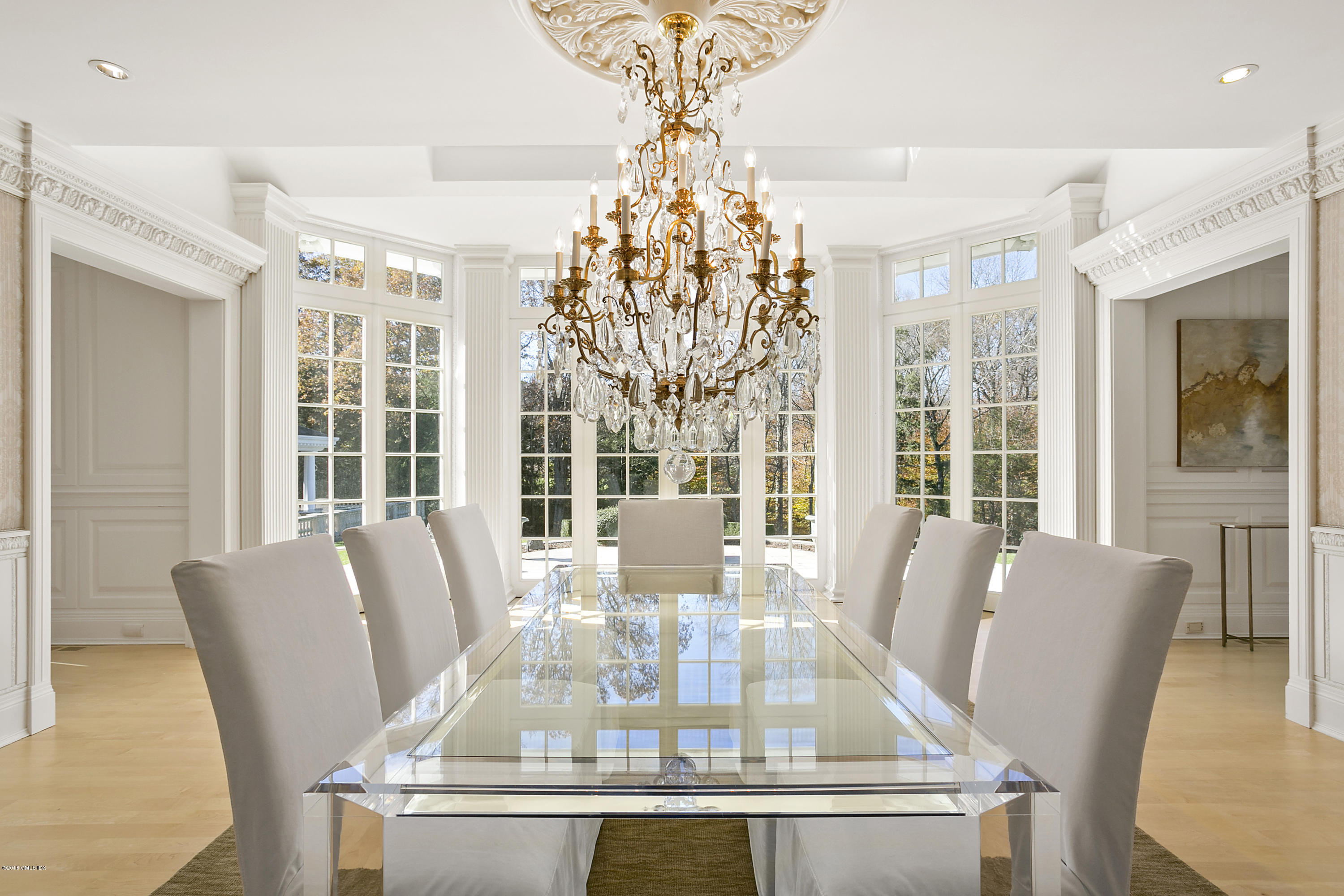 20 Andrews Farm Road Greenwich, CT 06831 - Photo 6 of 39 a view of a dining room with furniture large windows and wooden floor