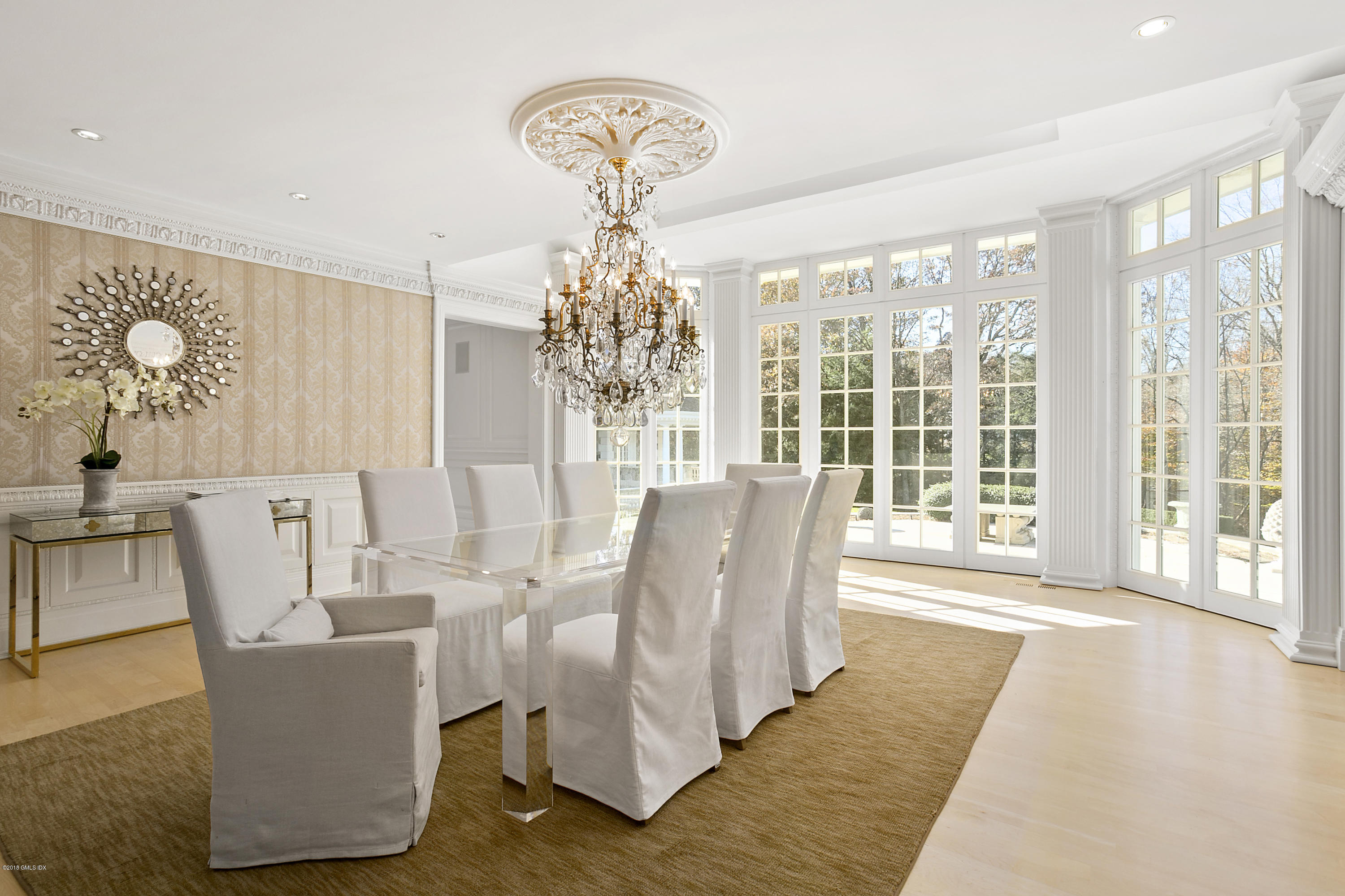 20 Andrews Farm Road Greenwich, CT 06831 - Photo 7 of 39 a living room with furniture and a chandelier