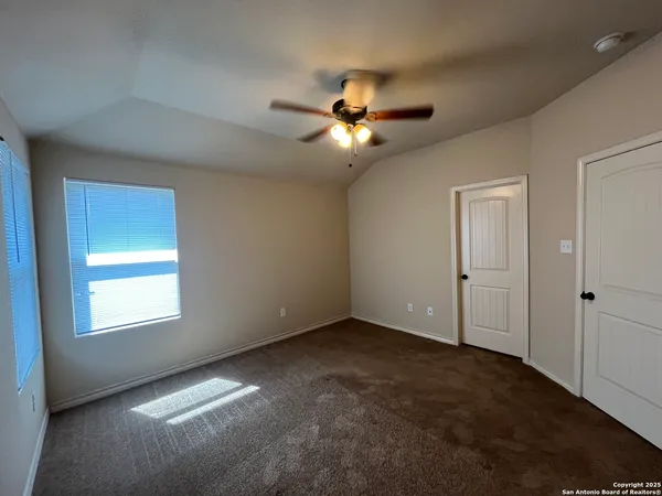 a view of empty room with fan