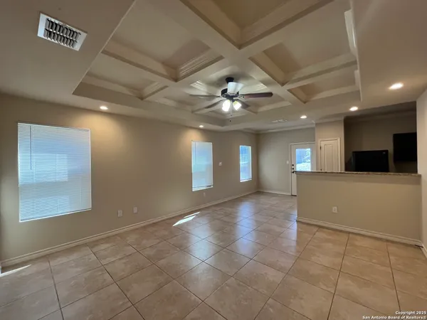 a view of a hallway with chandelier