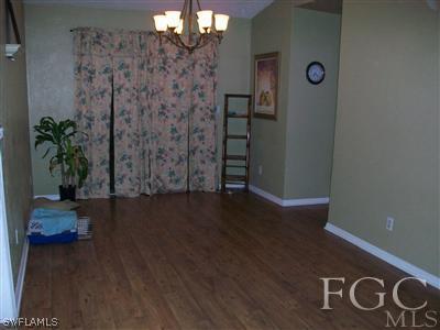 17464 Lee Road Fort Myers, FL 33967 - Photo 7 of 10 a view of empty room with wooden floor