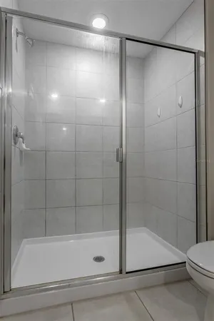 a bathroom with a shower and a bathtub