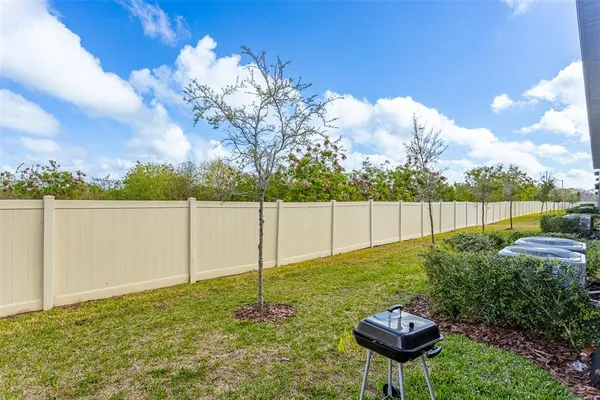 a backyard of a house with lots of green space