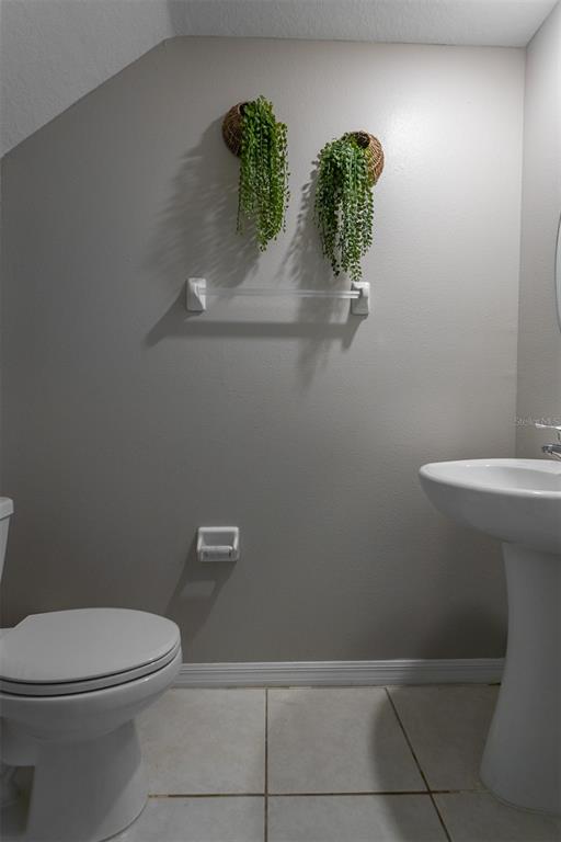 14206 Easy Goer Street Ruskin, FL 33573 - Photo 10 of 28 a bathroom with a toilet