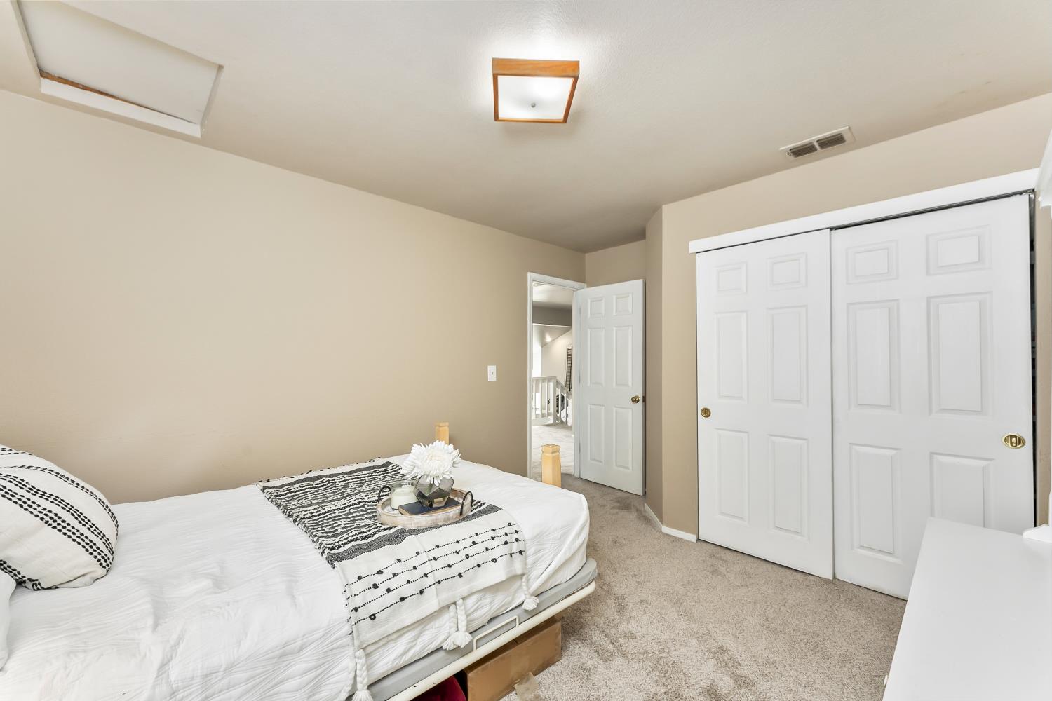 3472 See View Court Rescue, CA 95672 - Photo 27 of 37 a bedroom with a bed and a window