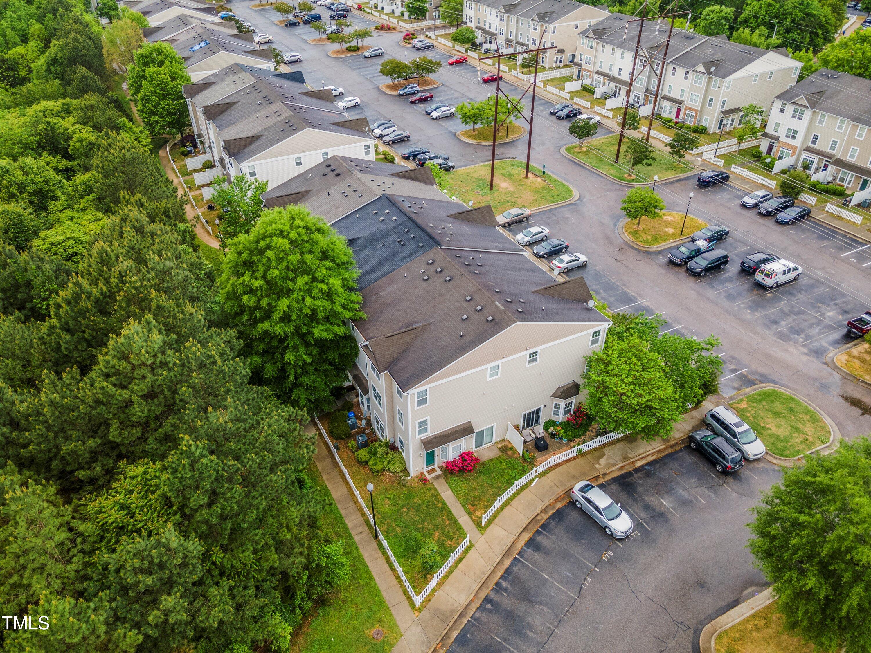 350 Gilman Lane, Unit 108 Raleigh, NC 27610 - Photo 33 of 34 Drone Shot of the building unit is in. Unit faces the trees
