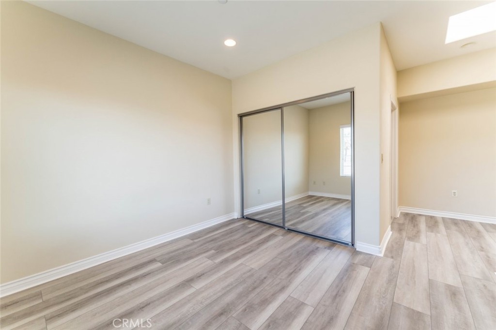 511 East Harvard Road, Unit 101 Burbank, CA 91501 - Photo 25 of 29 wooden floor in an empty room