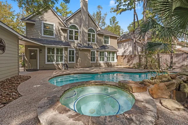 a view of a house with a swimming pool