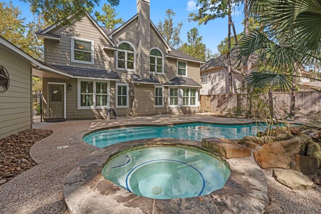 a view of a house with a swimming pool