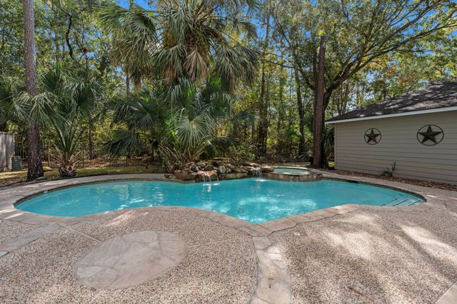 a view of backyard with swimming pool