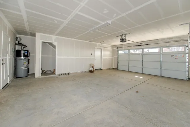 a view of a house with backyard and garden