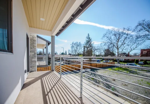 a view of a building with wooden floor and a outdoor space