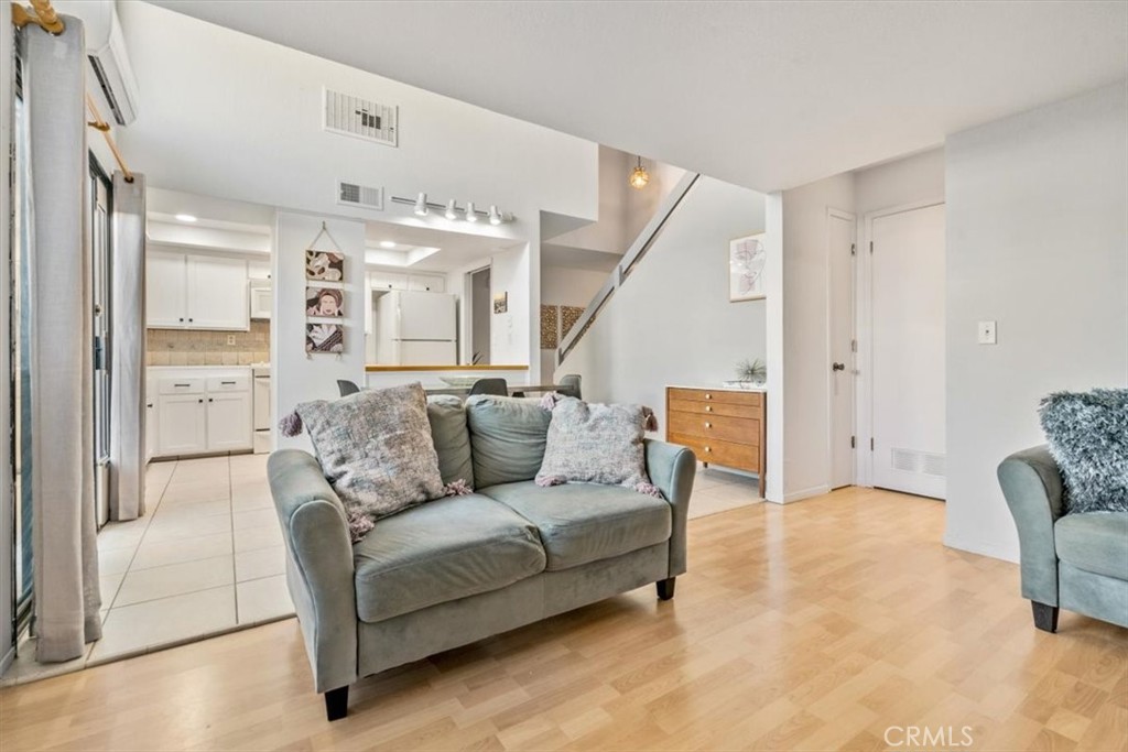284 Spruce Street Arroyo Grande, CA 93420 - Photo 12 of 31 a living room with furniture and a chandelier