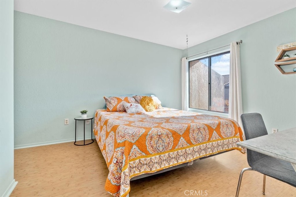 284 Spruce Street Arroyo Grande, CA 93420 - Photo 20 of 31 a bedroom with a bed and chair