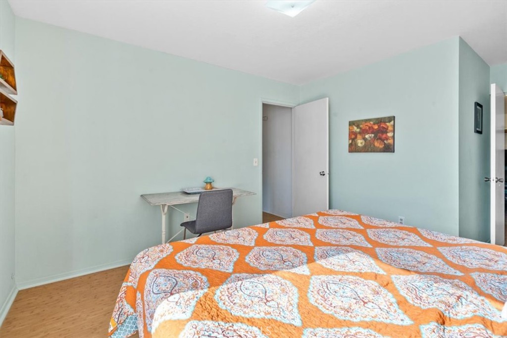 284 Spruce Street Arroyo Grande, CA 93420 - Photo 21 of 31 a bedroom with a bed and a lamp on dresser