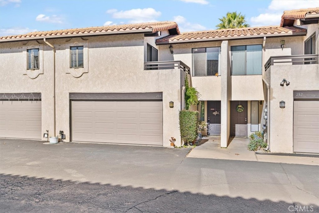284 Spruce Street Arroyo Grande, CA 93420 - Photo 23 of 31 a view of a white house with large windows