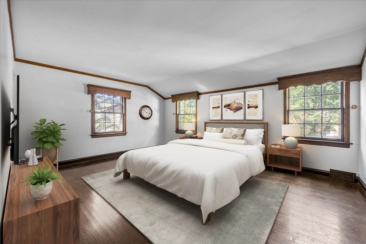 912 Pontiac Road Wilmette, IL 60091 - Photo 12 of 25 a bedroom with a large bed and a large window