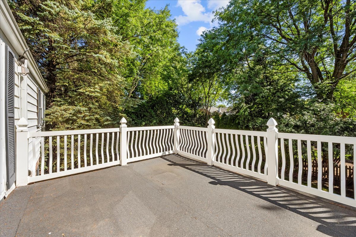 912 Pontiac Road Wilmette, IL 60091 - Photo 16 of 25 a balcony with wooden floor and fence