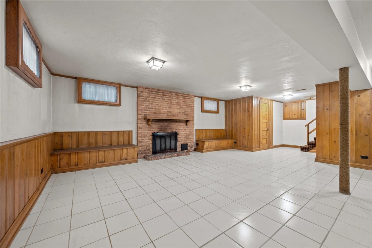 912 Pontiac Road Wilmette, IL 60091 - Photo 20 of 25 a view of an empty room with a fireplace and a window