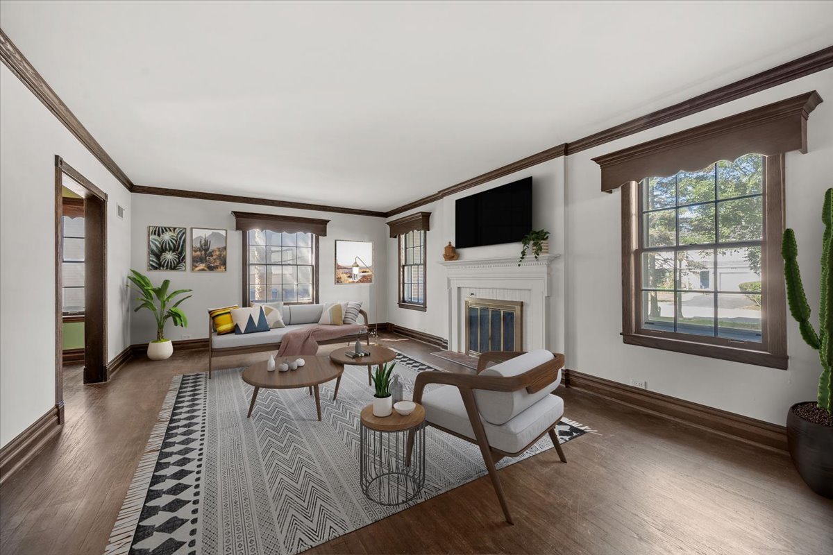 912 Pontiac Road Wilmette, IL 60091 - Photo 4 of 25 a living room with furniture a fireplace and a flat screen tv