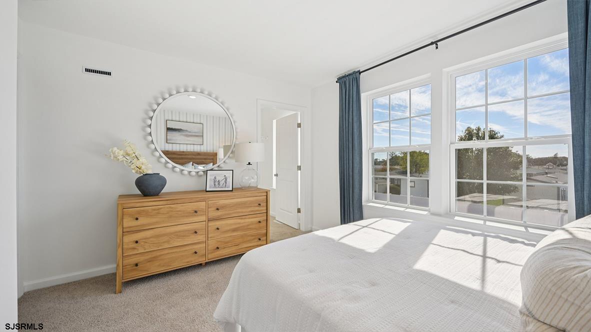 5 Dalton Way, Unit 103 Rio Grande, NJ 08242 - Photo 38 of 41 a bedroom with a bed and a window
