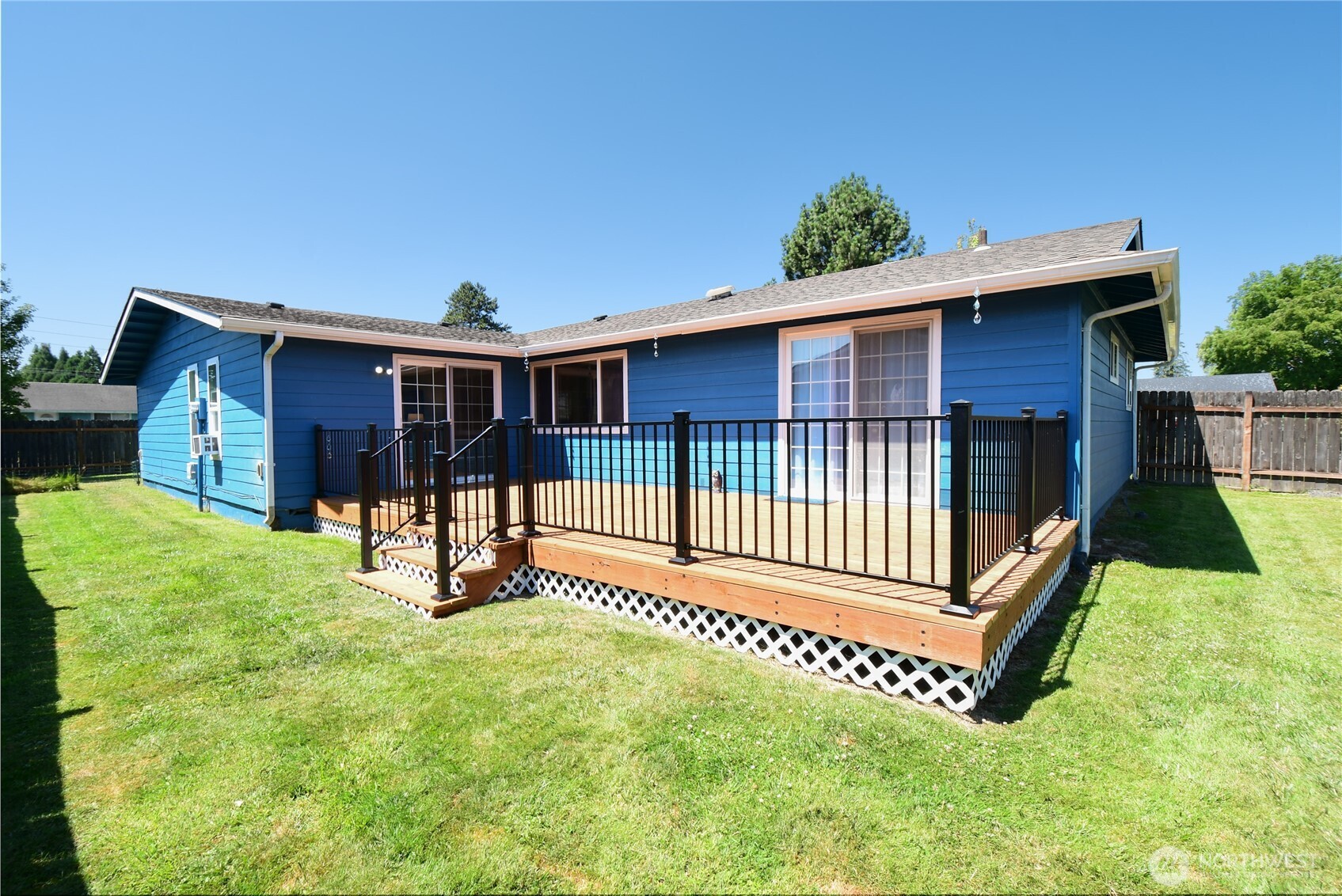 2102 35th Avenue Longview, WA 98632 - Photo 26 of 31 a view of a house with a yard patio and a small yard