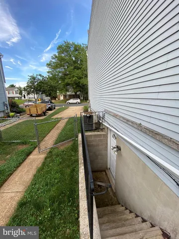 a view of a backyard with sitting area