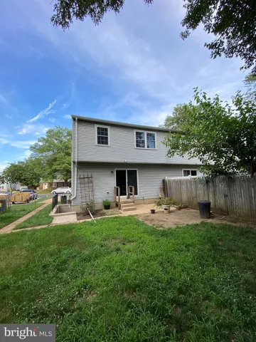a house view with a sitting space and garden