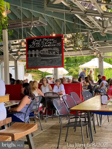 a view of a chairs and table in patio